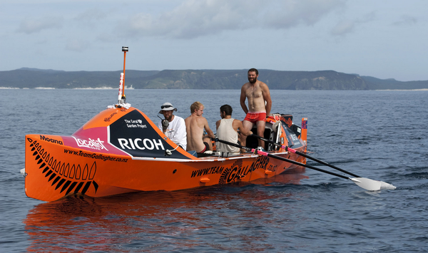 Team rowing down New Zealand coast.