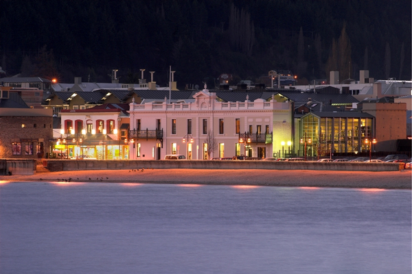 An evening view of Queenstown's Eichardt's Private Hotel.