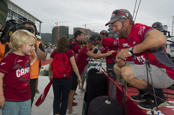 Chris Nicholson greets his son Banjo at the finish of Leg 3.