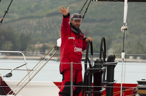 Chris Nicholson waves as CAMPER crosses the finish line for Leg 3.