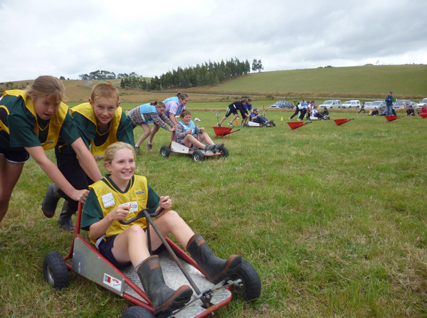 Prue Buckingham, Lachlan Crosbie and Jessica Dermody, also known as the Tokanui Redbands, race to victory in the AgriKidsNZ Race-off.