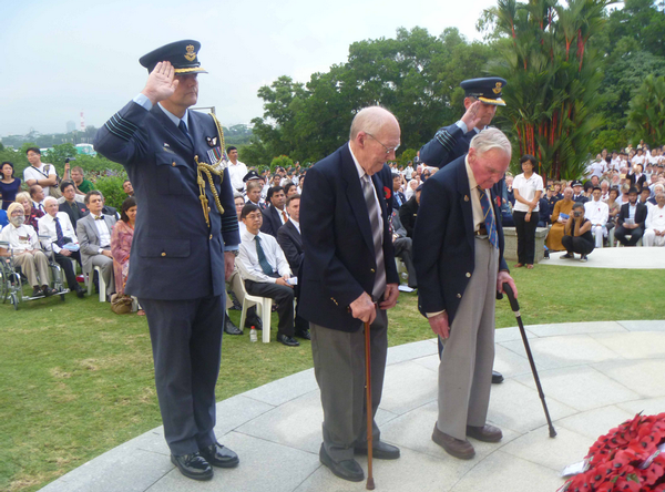 Wreath laying at Kranji War Cemetery in Singapore to mark the 70th anniversary of the fall of Singapore (left to right Group Captain Tim Walshe, NZ Defence attach&#233;, Ted West, Bill Mitchell, Group Captain Darryn Webb (obscured).
