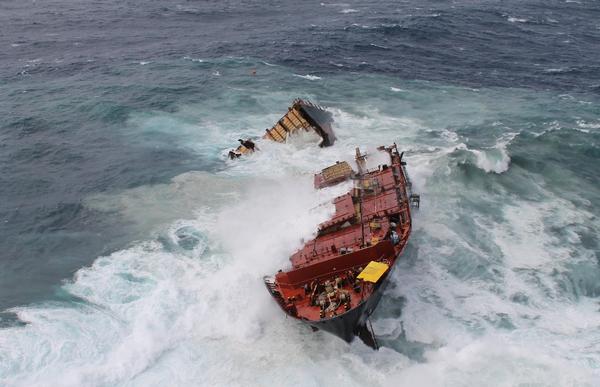 View of broken Rena in heavy sea swells.