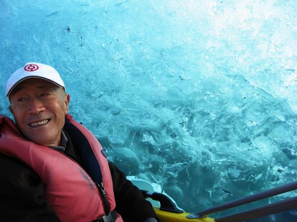 Fresh blue ice exposed by the Tasman Glacier calving on April 30th - Chinese guest travelling with ANZ Sky Tours tour group.