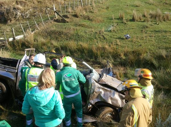 The vehicle had left the road and rolled a number of times before coming to rest upright in a small creek.