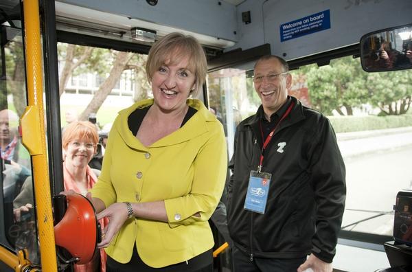 Minister for Communications and Information Technology, the Hon Amy Adams, uses her 2degrees Touch2Pay Smartphone to pay her bus fare.