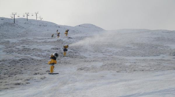 Snow guns crank into action at Queenstown's Coronet Peak ski area.