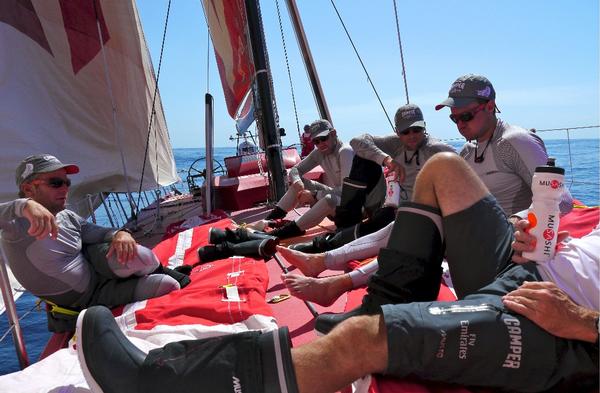 A light airs gathering on CAMPER's foredeck.