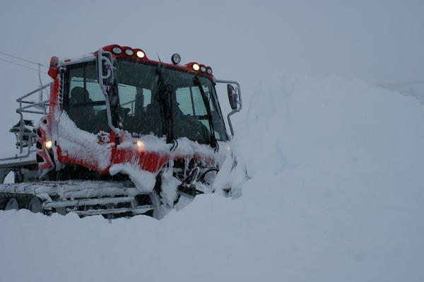 Carl McHugh drives a snow blade through piles of the white stuff at the Mt Hutt base area.