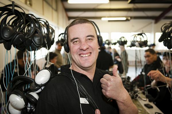 Tane Griffin from Altus Enterprises refurbishing headsets for Air New Zealand.
