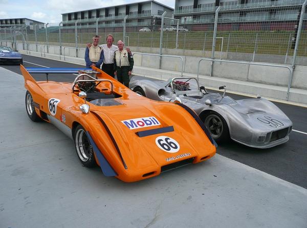 From left, Barry Kirk-Burnannd and his orange 1969 McLaren M12 7800cc, with Hampton Downs' Tony Roberts and Paul Halford with his silver 1965 McLaren M1A/B 5300cc.