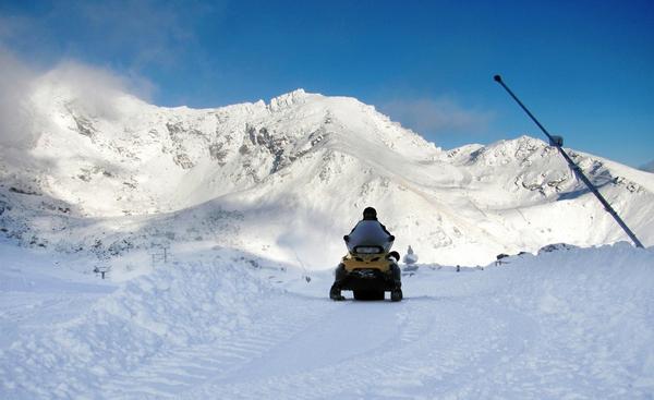 The Remarkables GM of Operations, Ed Bezett riding a snow mobile at The Remarkables today (June 14).