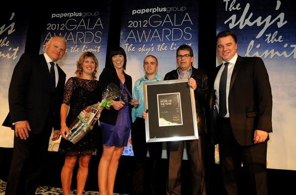 From left to right: Paper Plus Group Chief Executive, Rob Smith; Paper Plus Hawera owner-operator Dallas McCallum and his family; Paper Plus Group Retail Manager, Simon Harkness.