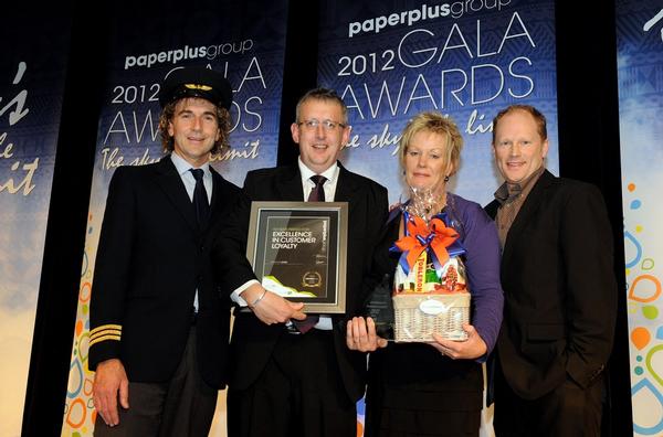 From left to right: Paper Plus Marketing Manager, Lyle Hastings; Paper Plus Gore  owner-operators Doug and Denise Grant; Fly Buys representative Trevor Jellie.    
