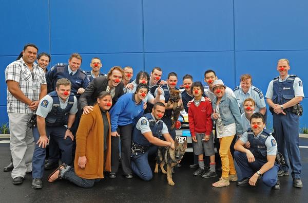 Police from Ormiston Police Station with Cure Kids ambassadors and Paper Plus Marketing Manager, Lyle Hastings.