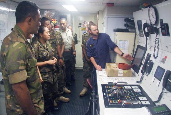 Members of HMNZS OTAGO working with a group from the Tongan Defence Force during the South Pacific Deployment.    