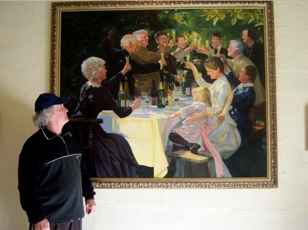 The original 'Otago Winemakers' oil on canvas pictured with artist Thomas Brown.