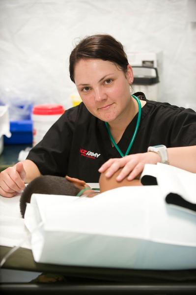 Lieutenant Nikki Houlahan, critical care nurse, cares for a 4 year old boy post operation.