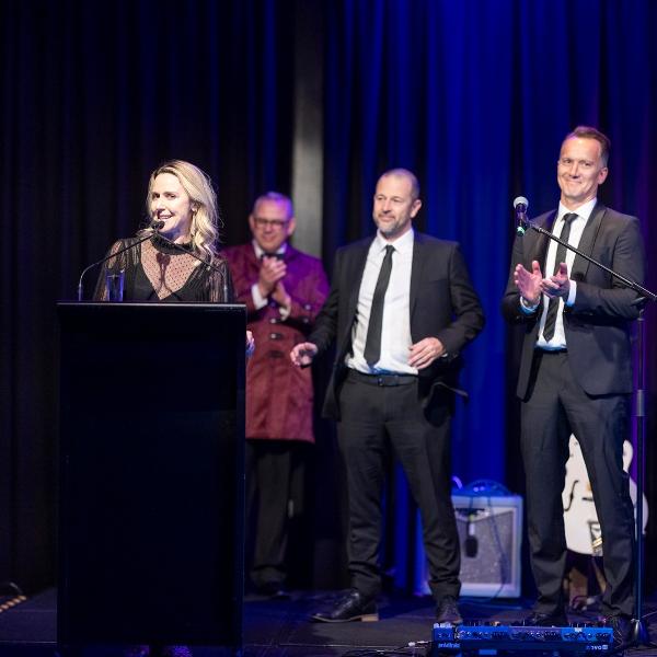Michelle Pearson accepts New Zealand's Property Management Agency of the Year (Large Office) at the 2025 PMC Property Management Conference
