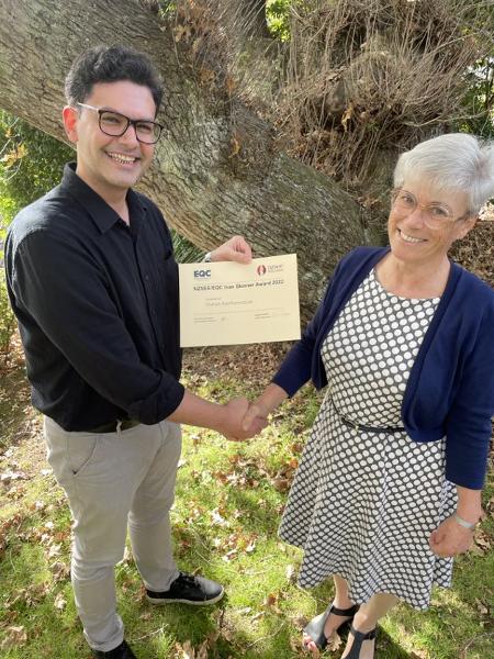 NZSEE President Helen Ferner (right) hands out the Ivan Skinner Award certificate to Dr Shahab Ramhormozian (left).