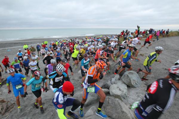 Competitors get underway in the Two Day Coast to Coast event on Kumara Beach on the South Island's West Coast.