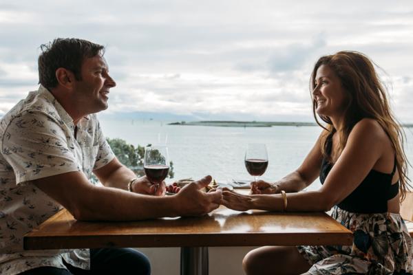 Couple Dining on Tahunanui Waterfront With Wine