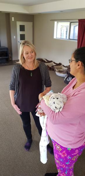Community based midwife Bex Tidball with new mum, Valentina with Tomas, born during Level 4 lockdown