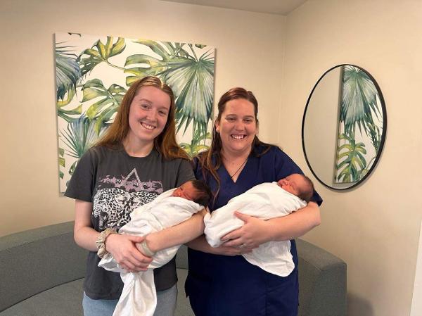 Midwife Elyse Lichtwark and Birthcare Huntly staff member Melissa Griffin with Mallik and Max.