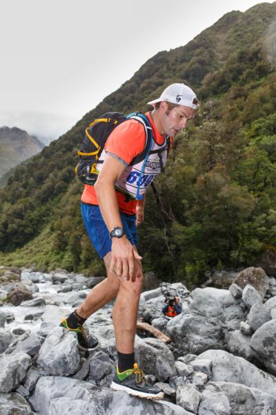 Richie McCaw, who was a late entry in the Kathmandu Coast to Coast, joining his wife Gemma in the 30 kilometre mountain running event today, tackles the boulders.