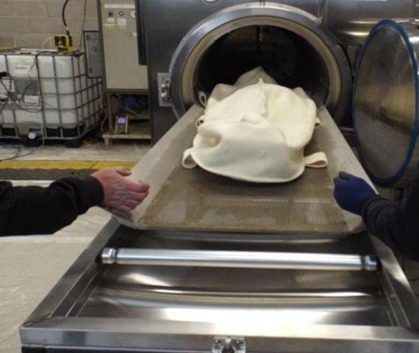 Body wrapped in shroud made of New Zealand wool