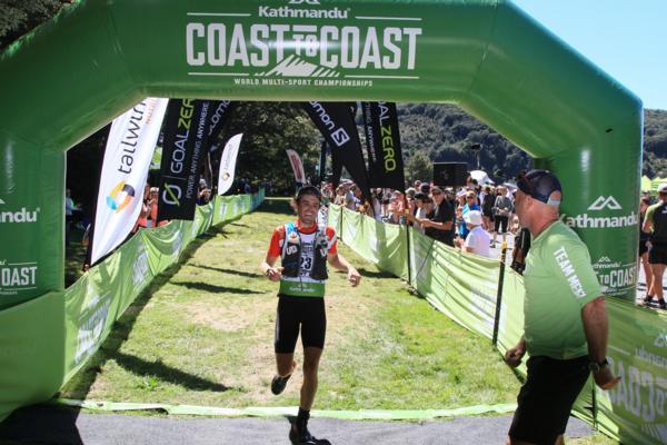 After breaking his leg 18 months ago Queenstown hiking guide Tony Phillips leads the individual two day event after a storming run over Goat Pass that left him with a four minute lead over Oliver Thompson 