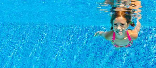Heat Pumps for Swimming Pools - girl in pool