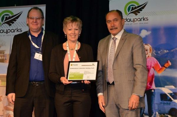 Peter and Cathy Coppens receive an award from Governor-General Sir Jerry Mateparae.