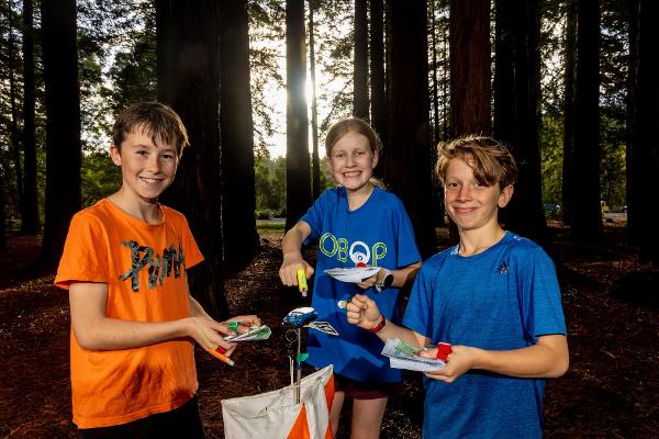 Delighted Rotorua Intermediate orienteering competitors (from left) Jamie Bennett, Elena Burns and Ryan Lei celebrate the inclusion of the code in next year's Zespri AIMS Games.