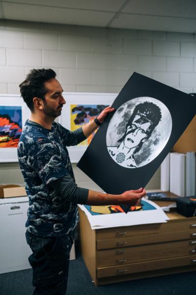 Brad Novak & his "Starman" print of David Bowie