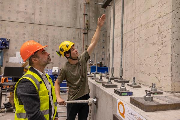 Professor Santiago Pujol discusses the wall tests with PhD candidate Charlie Kerby at the Structural Engineering Laboratory at the University of Canterbury.