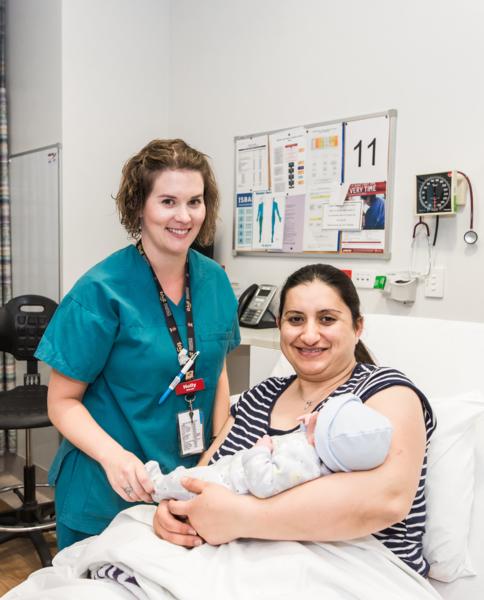 Mum with her new baby and supported by her midwife