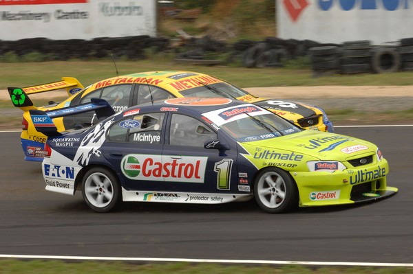 John McIntyre (car #1) passes Clark Proctor at Manfeild. 