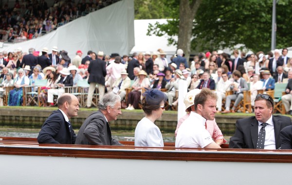 Coach Dave Thompson (far right) chats with the Princess Royal on the umpire's launch that followed the race