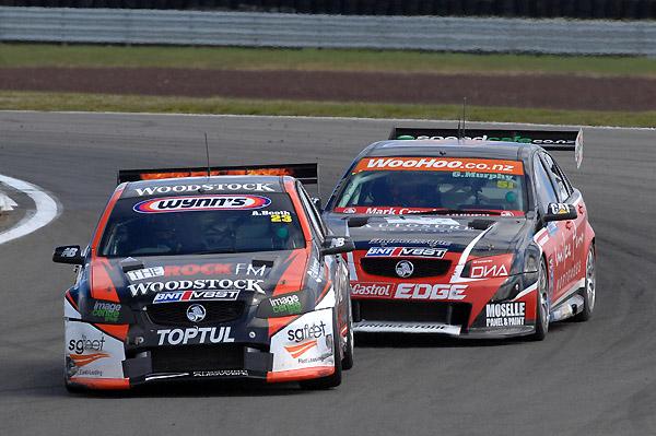 Andy Booth (front) battles with Greg Murphy on the way to Booth's first race win in the BNT V8 SuperTourer series.