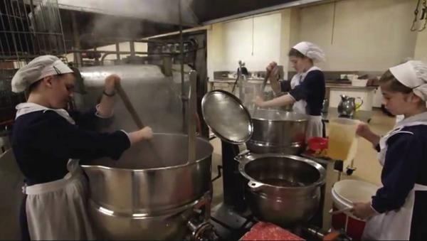 Women working in the Gloriavale kitchen