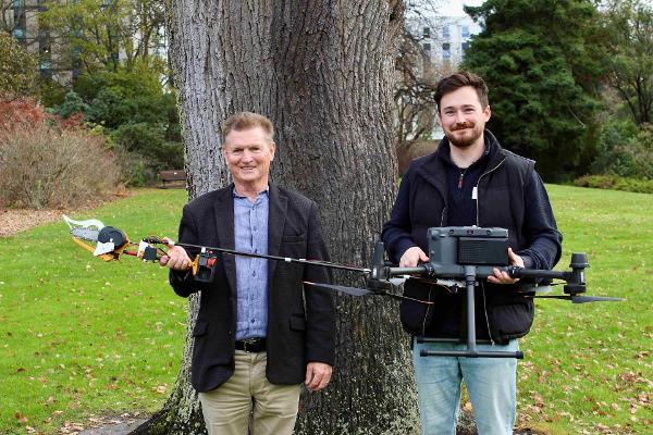 Professor Richard Green and Dr Sam Schofield with the new chainsaw drone they've developed as part of the UC Vision research team project. 