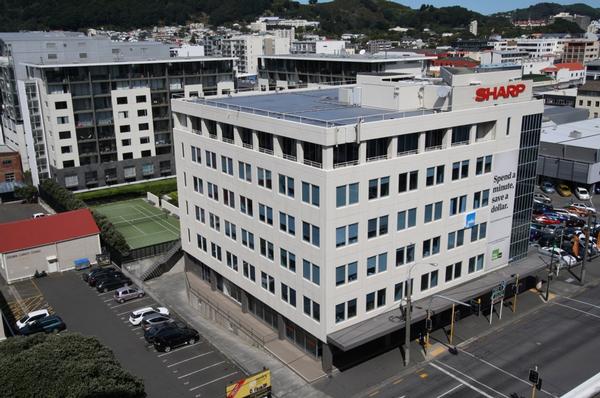 Calculated to generate positive revenues - the imposing Sharp House office block in Taranaki Street is on the market for sale.