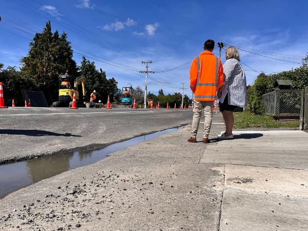 Mayor Alex Walker on the site of the water main break on Porangahau Road in Waipukurau this morning, with Council staff.