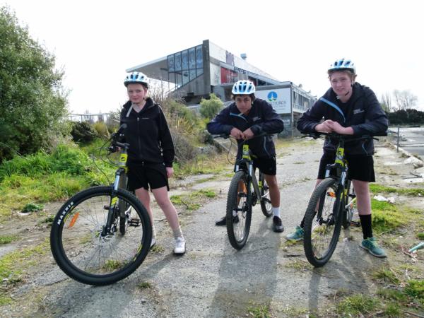Three of the six Aranui High School students in with the opportunity to compete in the Coast to Coast next year alongside some legends of New Zealand multi-sport, Mikayla Scott, Taitama Tukaki and Andrew Gordon, with their new Giant Mountain bikes.