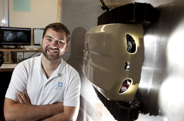  Invert Robotics CEO James Robertson and one of Invert Robotics wall-climbing robots