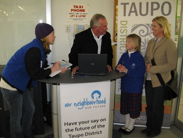 Mayor Rick Cooper with Ambassador Jess Steadman interviewing shoppers outside Woolworths