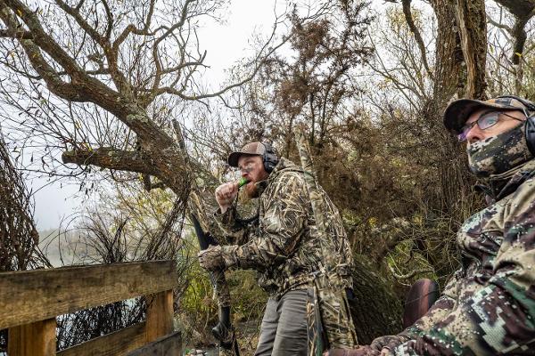 Hunter Paul Thomas, centre, calls in the ducks near Rakaia on Opening Day.