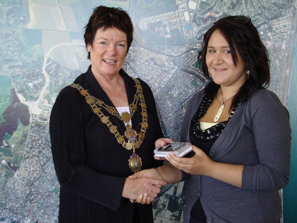 Raechel Taurima is presented with an iPod Touch by Mayor Barbara Arnott