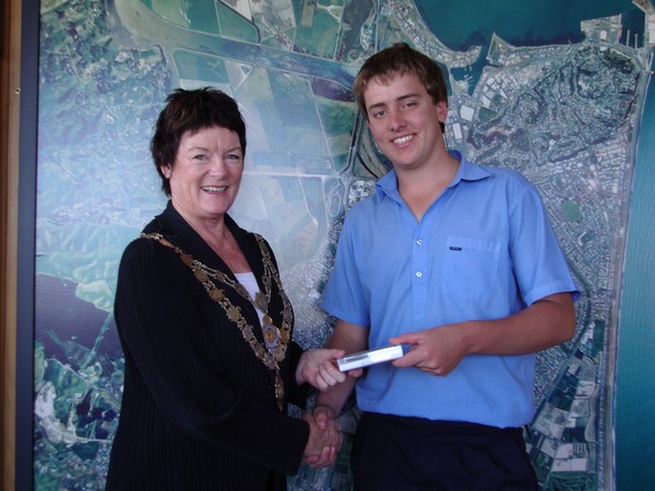 Grant Porter, of Napier Boys High School, is presented with an iPod Touch from Mayor Barbara Arnott.